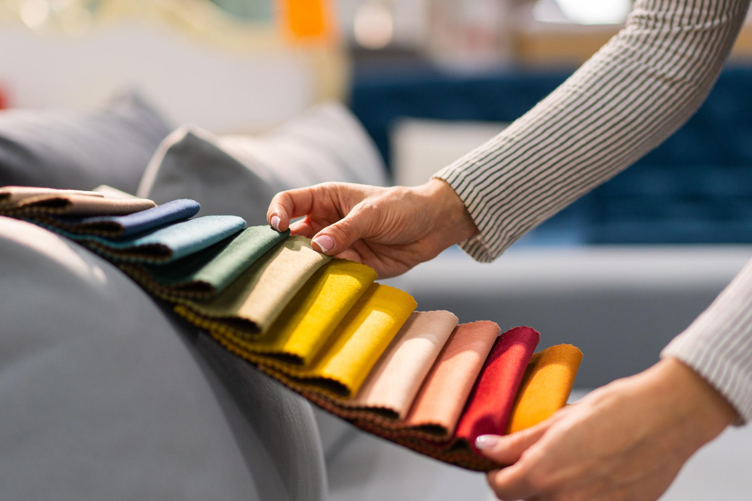 Woman choosing fabric colors for sublimation printing.