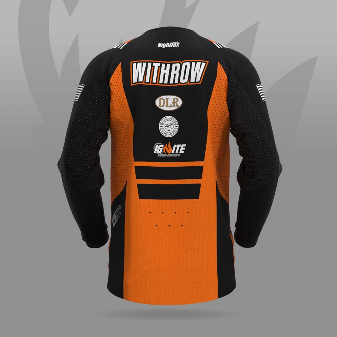 2024 MTB jersey design for Ignite Biking, featuring orange and black colors inspired by the team logo flame.