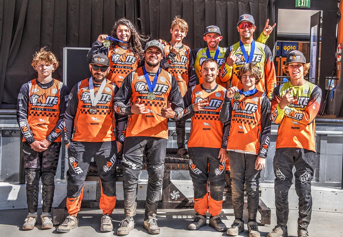 Ignite Biking team photo with all members wearing full-custom Nightfox MTB gear.