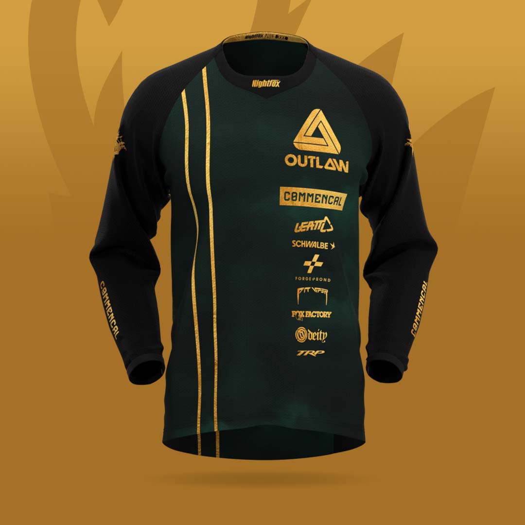 Outlaw MTB 2024 dark green jersey with gold details, team and sponsor logos, and personalized rider name on the back.