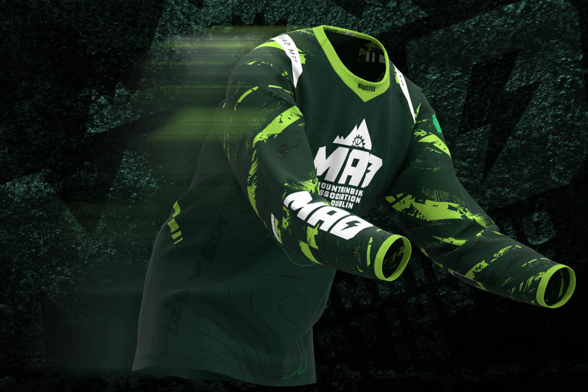 3D mockup of the new MAD MTB team jersey from Dublin, featuring a forest green base with lime green details in motion.