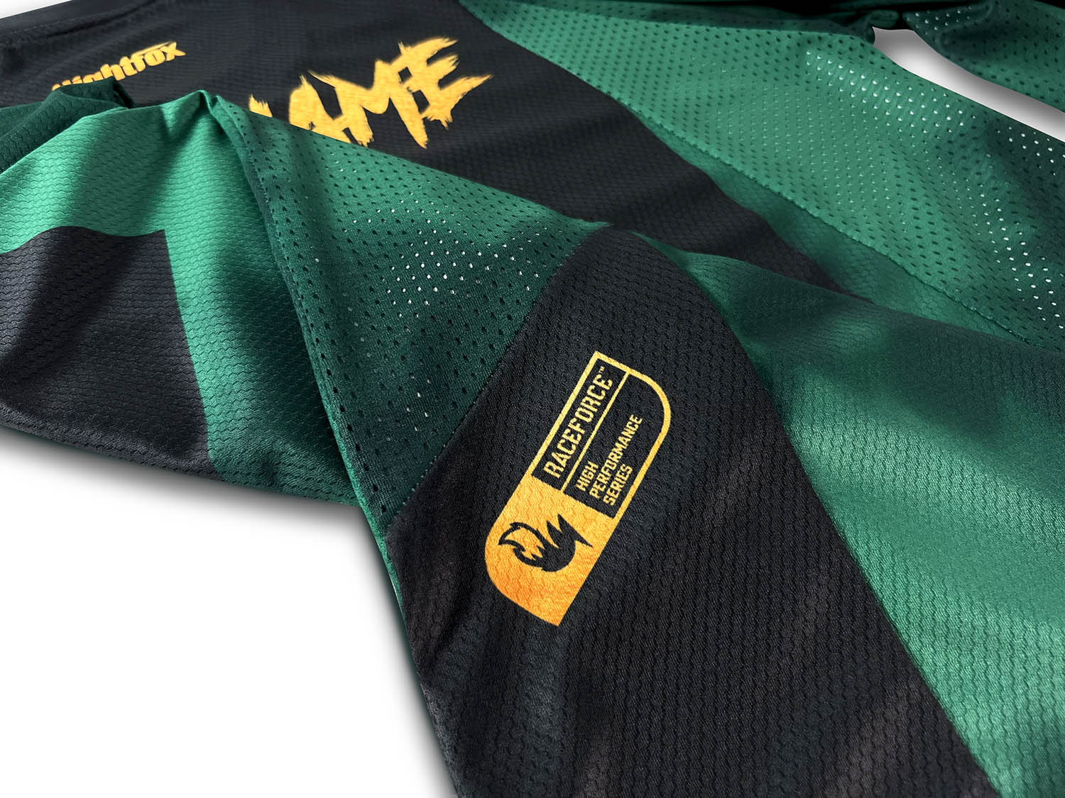 Studio photoshoot of GAP MTB’s new custom jersey, featuring a forest green base with black and gold details, designed by Nightfox for Glencullen Adventure Park, Ireland’s top MTB destination.