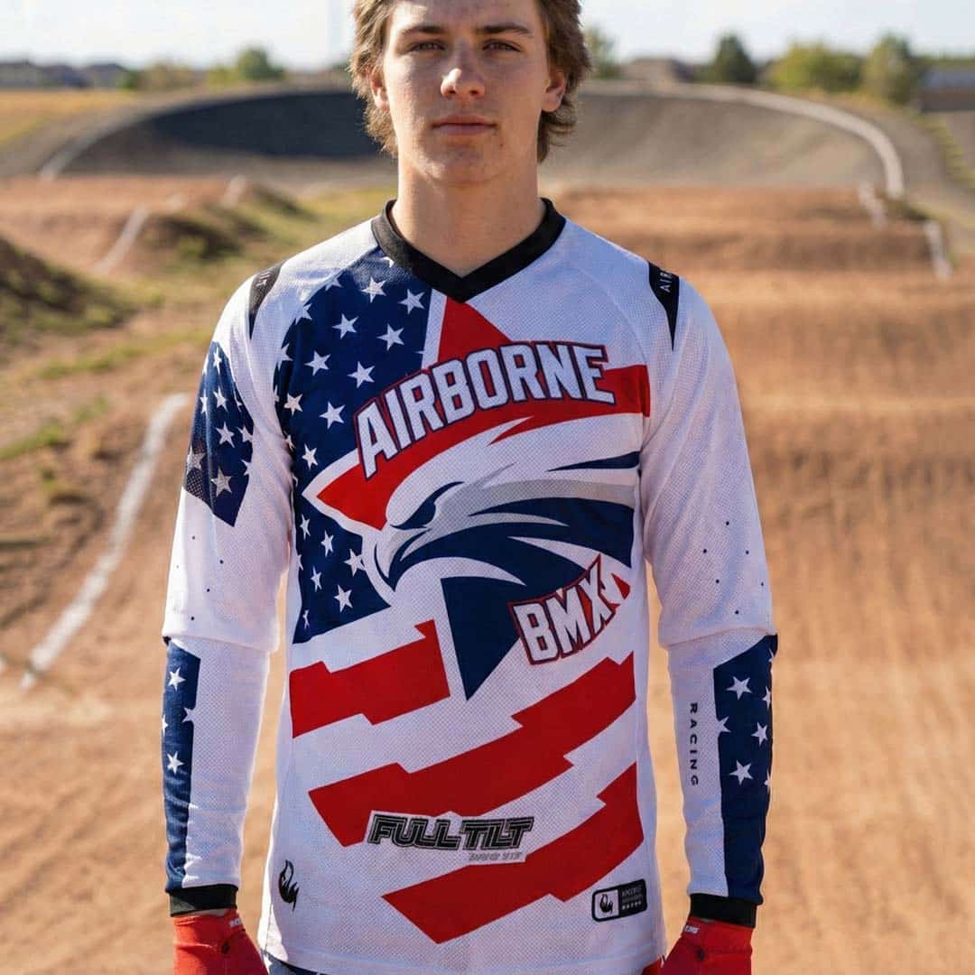 Custom BMX Jersey for Team Airborne – USA BMX Grand Nationals Team Airborne custom BMX jersey for USA BMX Grand Nationals, white, red, and blue US flag design by Nightfox. Premium sublimation, fast delivery, no minimum order.